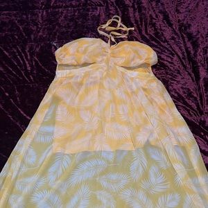 Long summer dress sides are cut out and the top ties around your neck halter top